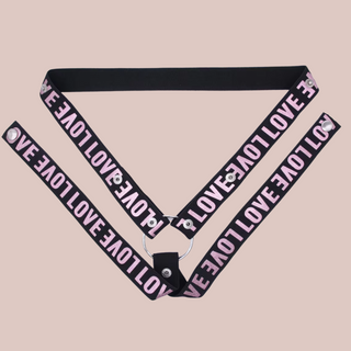 The pink 3 way restraining belt, you can see that the black belt has a pink Love logo emblazoned across it.