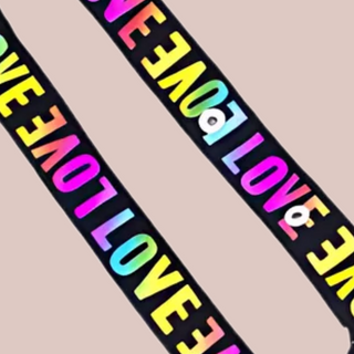 A close up of the multicoloured straps, showing the LOVE motif.