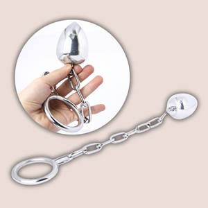A full length image of the Anal Egg with Chained Cock Ring from House Of Chastity and a smaller image showing the product being held to give an idea of size.
