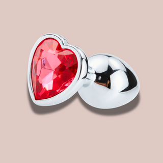 A close up view of the heart shaped red jewelled end to the large butt plug from House Of Chastity.