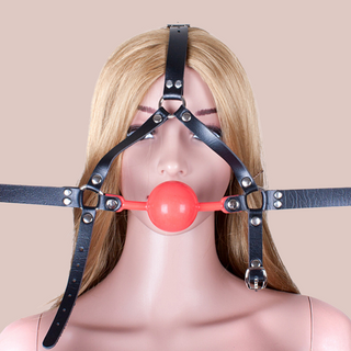 The studded lockable head harness with red 48mm ball gag, shown against a model, you can see how it will fit the wearer,