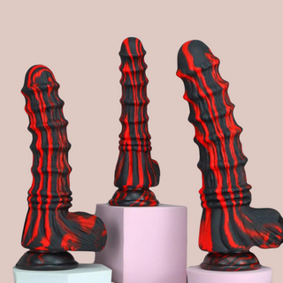 All 3 sizes of The Fire Monster Dildo gathered together, from left to right we have medium, small and large.