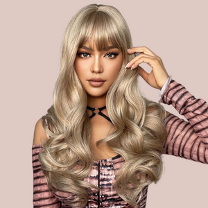 A blonde ombre long-length wig with a gorgeous soft curl running through it. Modelled for House of Chastity it has a very natural flowing look. There is a soft fringe.