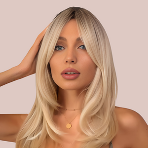 HOC259-1 Flowing Layered Locks Wig modelled for House of Chastity. A natural-looking wig with the dark roots flowing into luscious blond locks, the wig has a gentle layered effect that really makes the hairstyle pop.