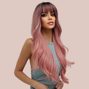 The Pink Ombre long length wig being modelled, you can see how the deep fringe softens the face and the layers and curls create a long flowing look.