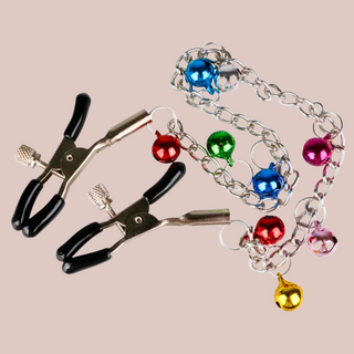 The long length nipple clamps shown lying down, you can see the chain and bells clearly.