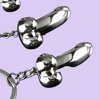 A close up of the penis keyring, you can see the glossy silver finish