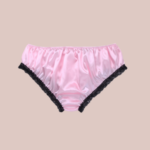 Back view, Adult knickers for men, sissy, lgbt, unisex. Made in pink satin with black lace detailing to the legs and panels on each side. There are also matching pink satin bows prettily applied. 