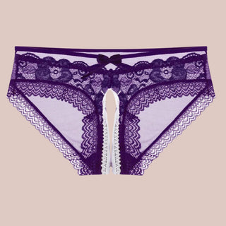 A close up of the purple see through mes hand lace panties, you can see the bow decorative detailing and crotchless design.