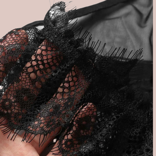 A close up of the lace detailing to the lingerie set