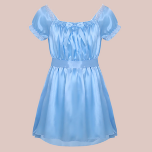 Shown here is the blue version of the satin night dress. It is an above knee length dress with a skater skirt, ruched satin bodice with decorative bow, square neckline, ruched and lace edged short sleeves and matching satin tie belt that has been tied at the back.