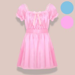 Shown here are both the pink and blue versions of the satin night dress. It is an above knee length dress with a skater skirt, ruched satin bodice, square neckline, ruched and lace edged short sleeves and matching satin tie belt that is tied into a large bow.