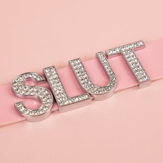 A close up of the diamante style lettering on the Slut Collar