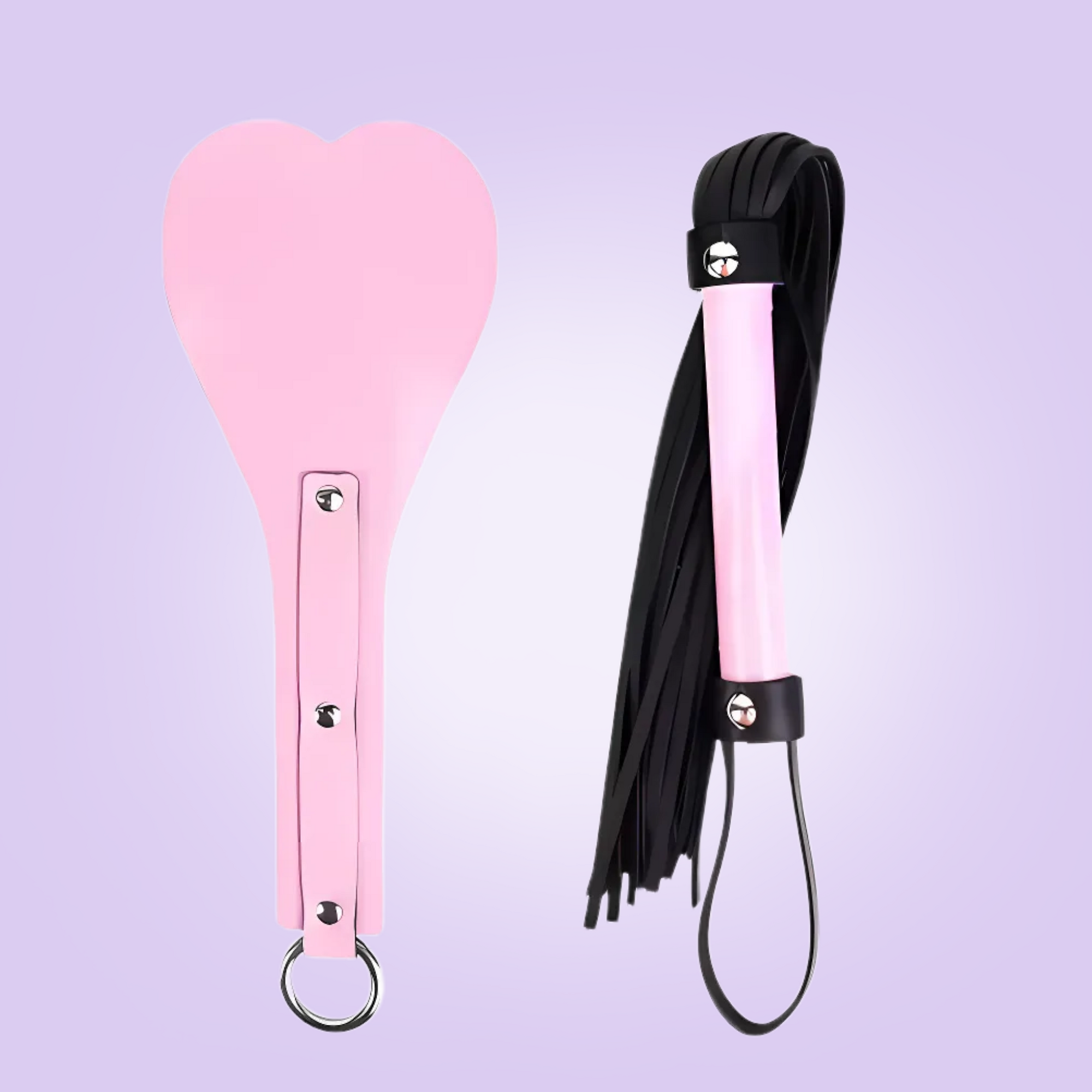 The pink two piece spanking paddle and whip, this set comes in a baby pink colour with black tassels and accenting to the whip.