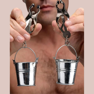 The bucket style nipple clamps are being held up, you can see how they will sit on the body.